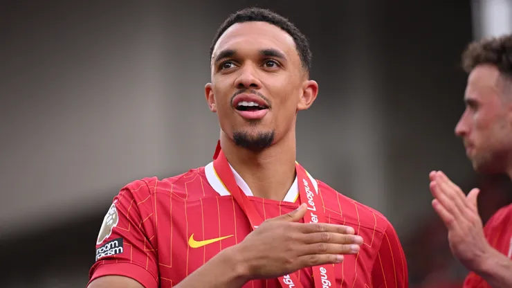 Trent Alexander-Arnold of Liverpool, celebrates after his final appearance for Liverpool as Liverpool are crowned the Champions of the Premier League for the 2024/25 Season, following the Premier League match between Liverpool FC and Crystal Palace FC at Anfield on May 25, 2025 in Liverpool, England.
