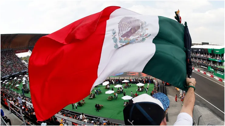 A fan waves a Mexican flag