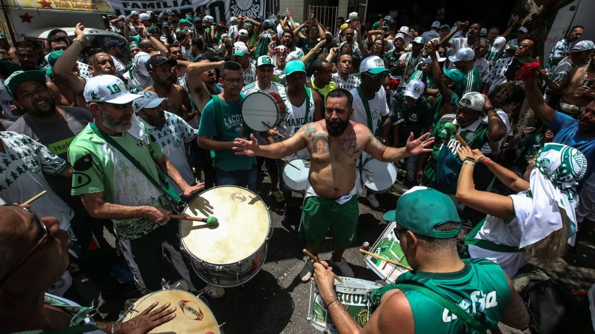 Fans of Palmeiras play drums and chant as they gather near Palmeiras clubhouse and Allianz stadium prior to the final match of FIFA Club World Cup in 2022. (Source: Alexandre Schneider/Getty Images)