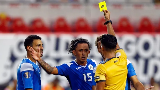 Byron Bonilla #15 of Nicaragua reacts while given a yellow card by referee Adonai Escobedo during the second half of a CONCACAF Gold Cup soccer match against Bermuda in 2019. (Source: Adam Hunger/Getty Images)