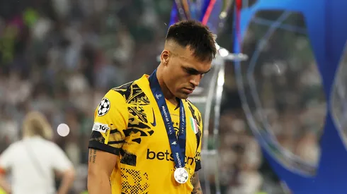 Lautaro Martinez of FC Internazionale looks dejected as he walks past the UEFA Champions League trophy after defeat to Paris Saint-Germain after the UEFA Champions League Final 2025 between Paris Saint-Germain and FC Internazionale Milano at Munich Football Arena on May 31, 2025 in Munich, Germany.