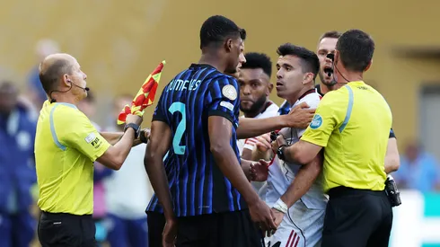 As tensions spilled over on the field, fans in the stands threw glasses and cups toward the tunnel area.