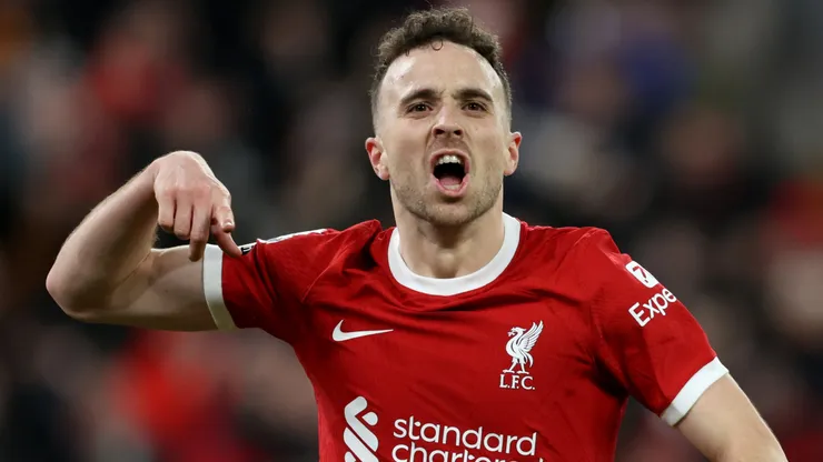 Diogo Jota of Liverpool celebrates scoring his team's first goal during the Premier League match between Liverpool FC and Chelsea FC at Anfield on January 31, 2024 in Liverpool, England.