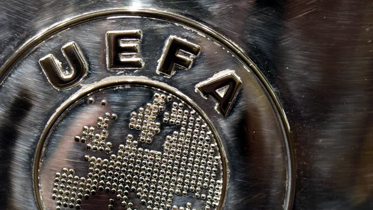 The UEFA logo is seen on the UEFA Champions League trophy as it is prepared for the UEFA 2014/15 Champions League third qualifying rounds draw at the UEFA headquarters, The House of European Football, on July 18, 2014 in Nyon, Switzerland.