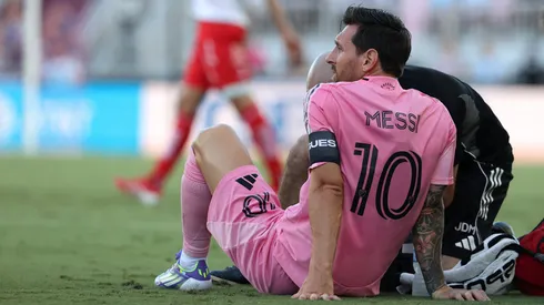 The Argentine star fell to the ground in frustration just 8 minutes into the game, receiving treatment before heading to the locker room.