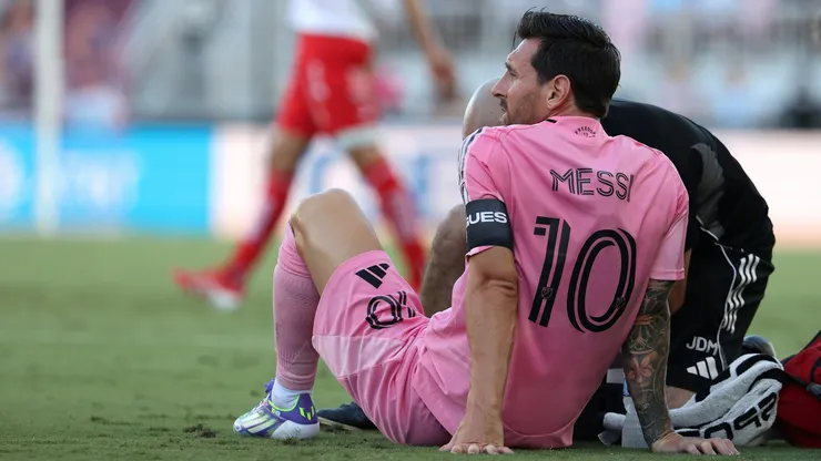 The Argentine star fell to the ground in frustration just 8 minutes into the game, receiving treatment before heading to the locker room.