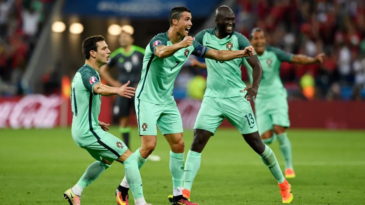 Cedric Soares, Cristiano Ronaldo and Danilo Pereira of Portugal congratulate Nani after scoring the second goal during the UEFA EURO 2016 semi final match vs Wales.