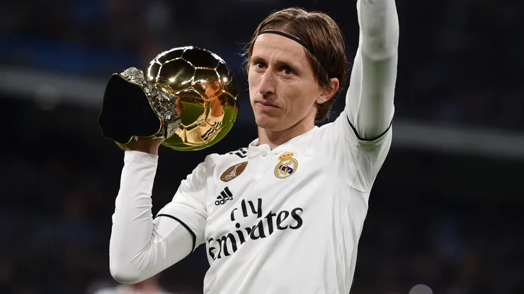 Luka Modric of Real Madrid presents his Ballon d'Or Trophy to the crowd.