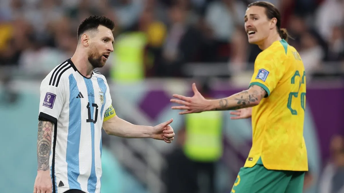 Lionel Messi and Jackson Irvine react during the FIFA World Cup Qatar 2022 Round of 16 match between Argentina and Australia on December 03, 2022.