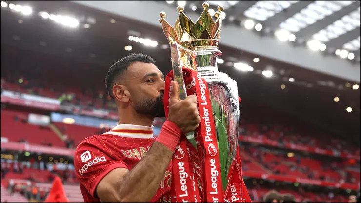 Mohamed Salah kisses the Premier League trophy, as Liverpool are crowned the champions of the 2024/25 season.