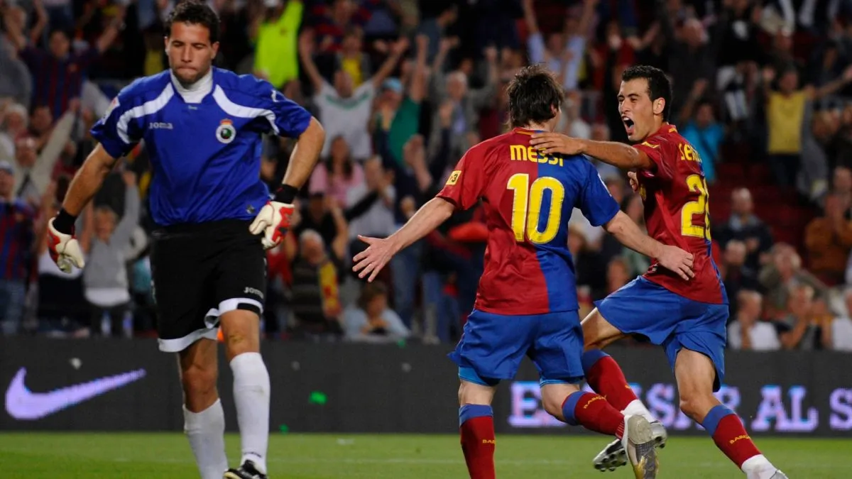 Lionel Messi of Barcelona celebrates with Sergio after scoring from the penalty spot during the La Liga match between Barcelona and Racing Santander at the Camp Nou stadium on September 13, 2008 in Barcelona, Spain.