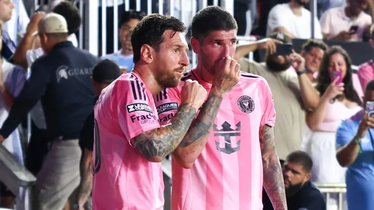 Lionel Messi #10 and Rodrigo de Paul #7 of Inter Miami speak on the field.
