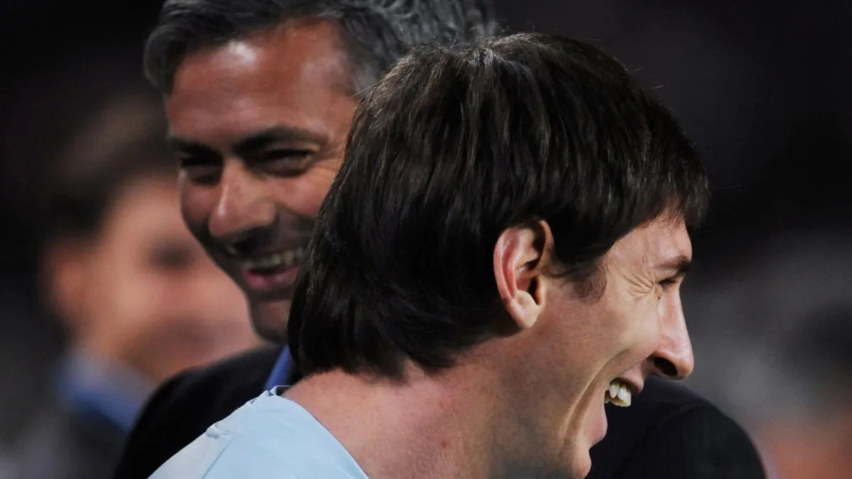 Lionel Messi of Barcelona smiles backdropped by Inter Milan coach Jose Mourinho on November 24, 2009.