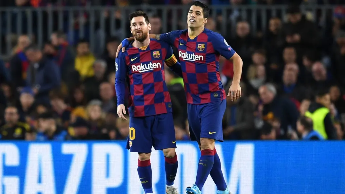 Luis Suarez celebrates with Lionel Messi after scoring Barcelona’s first goal during the UEFA Champions League match against Borussia Dortmund on November 27, 2019.