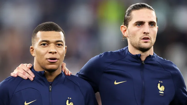 Kylian Mbappe and Adrien Rabiot line up for the national anthem prior to the FIFA World Cup Qatar 2022 Round of 16 match between France and Poland.