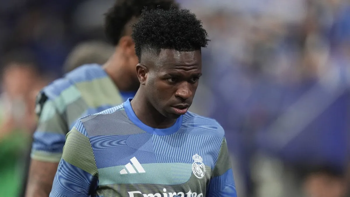 Vinícius Júnior of Real Madrid walks to the substitutes bench during the LaLiga EA Sports match between Real Oviedo and Real Madrid CF at Carlos Tartiere on August 24, 2025 in Oviedo, Spain.
