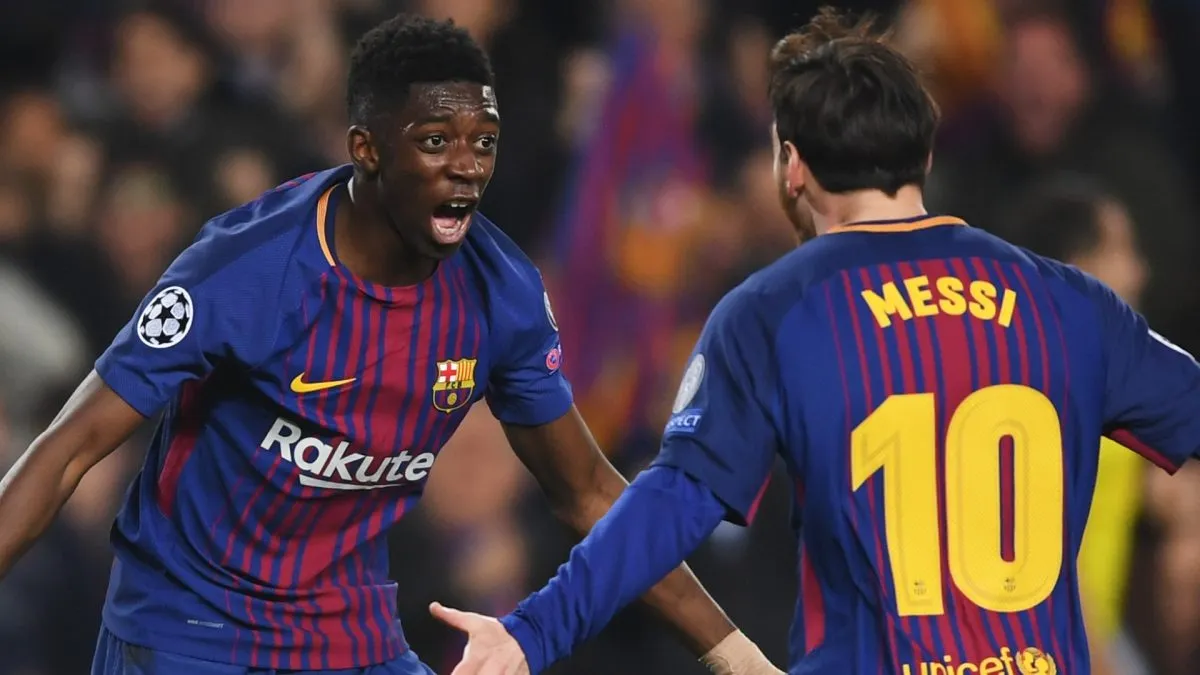 Ousmane Dembele celebrates with Lionel Messi as he scores a goal during the UEFA Champions League match between Barcelona and Chelsea FC on March 14, 2018
