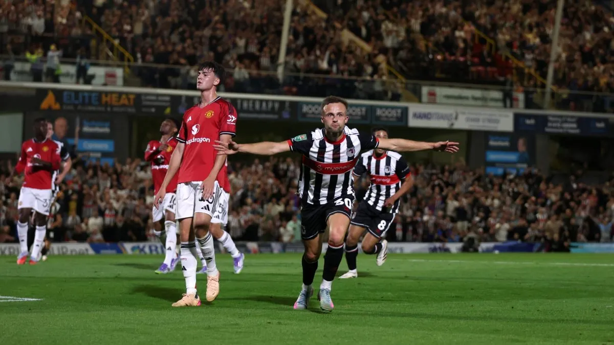 Charles Vernam of Grimsby Town celebrates scoring his team’s first goal during the Carabao Cup match vs Manchester United.