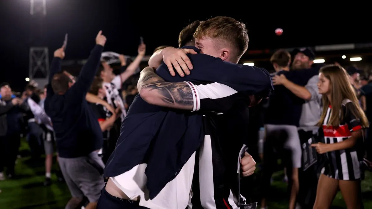 Grimsby Town fans celebrate victory over Manchester United.