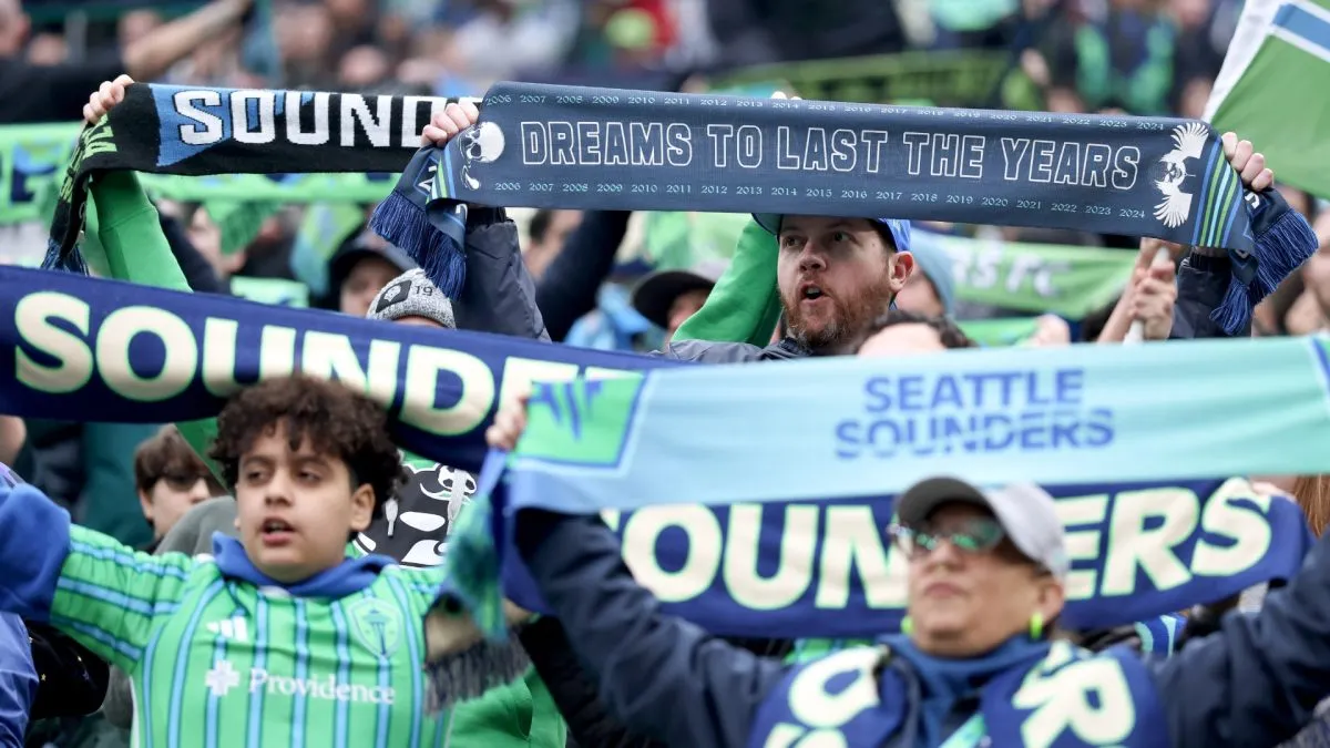 Seattle Sounders fans hold up their scarves before the game against the Los Angeles FC in 2025. (Source: Steph Chambers/Getty Images)