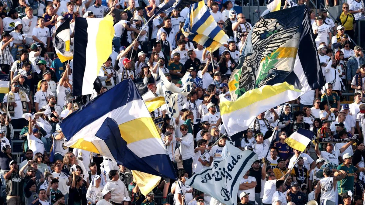 Supporters of LA Galaxy wave flags against the Los Angeles Football Club in 2025. (Source: Luke Hales/Getty Images)