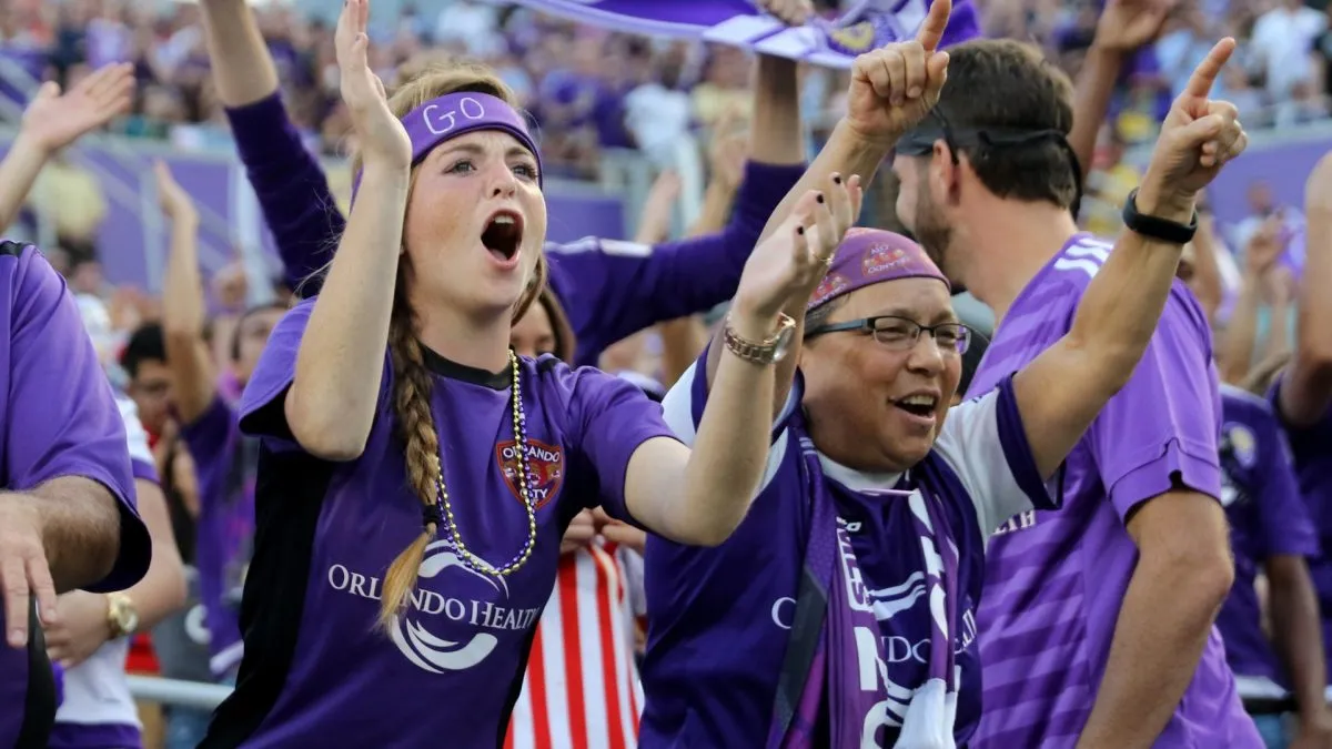 Fans celebrate a goal during an MLS soccer match between the New York City FC and the Orlando City SC in 2015. (Source: Alex Menendez/Getty Images)