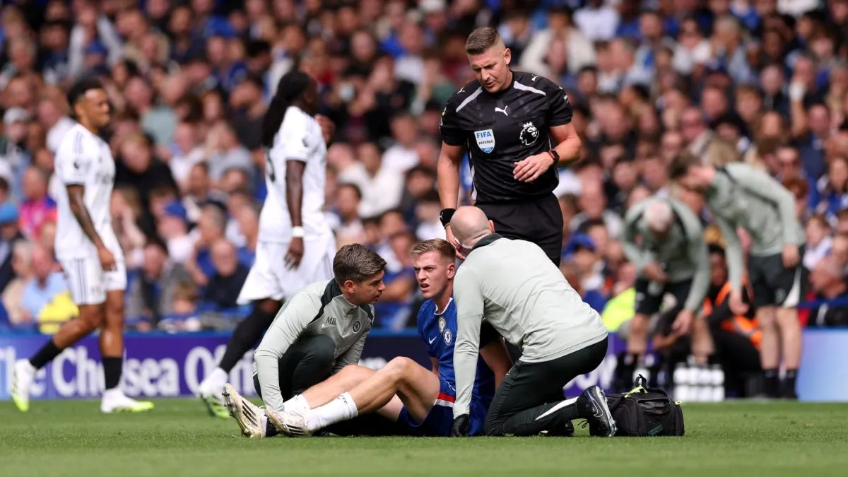 Liam Delap of Chelsea receives medical treatment during the Premier League match between Chelsea and Fulham at Stamford Bridge on August 30, 2025 in London, England.