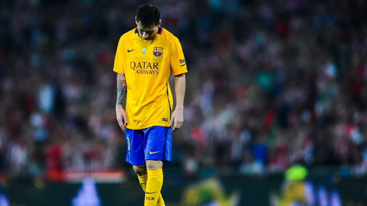 Lionel Messi of FC Barcelona looks down dejected during the Spanish Super Cup first leg match between FC Barcelona and Athletic Club at San Mames Stadium on August 14, 2015 in Bilbao, Spain.
