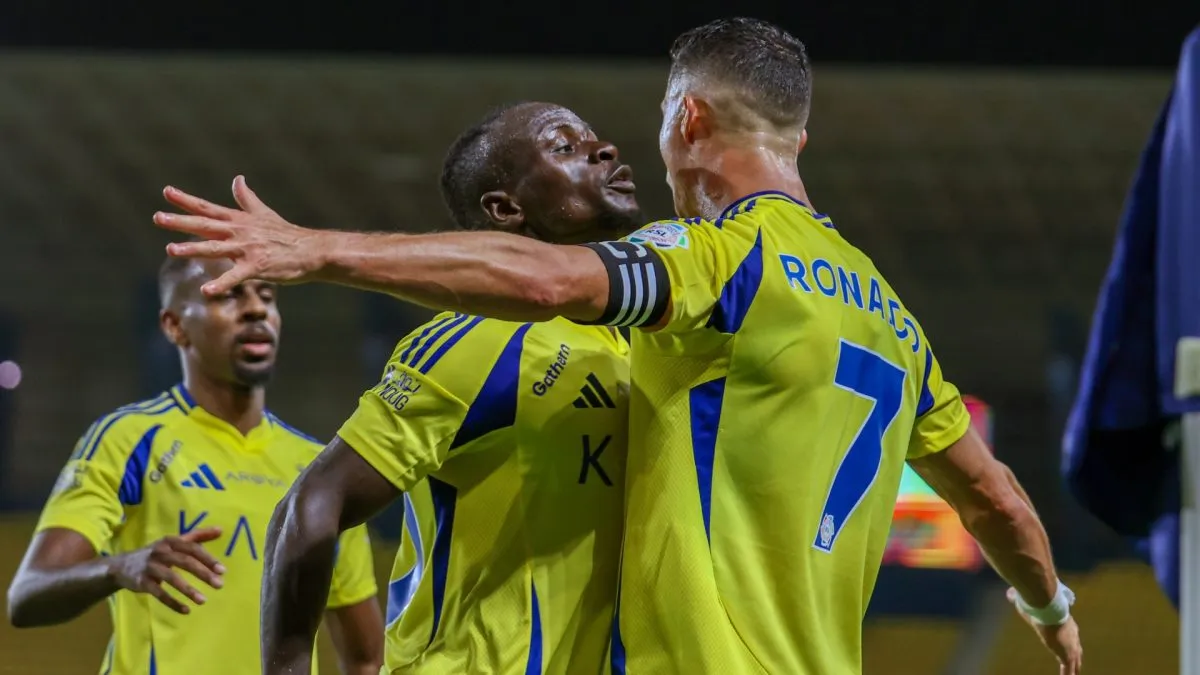 Cristiano Ronaldo of Al Nassr celebrates with teammate Sadio Mane after scoring the 1st goal during the Saudi Pro League match between Al Nassr and Al Raed.