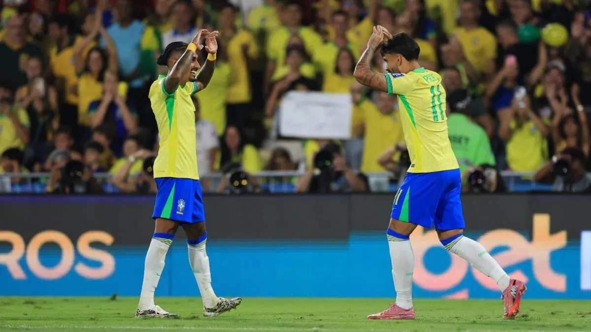 Lucas Paqueta of Brazil celebrates after scoring the team's second goal with teammate Raphinha during the South American FIFA World Cup 2026 Qualifier match between Brazil and Chile.