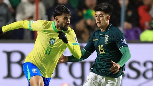 Lucas Paqueta of Brazil is challenged by Gabriel Villamil of Bolivia during the South American FIFA World Cup 2026 Qualifier match.