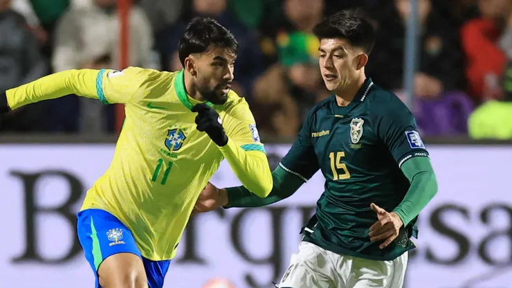 Lucas Paqueta of Brazil is challenged by Gabriel Villamil of Bolivia during the South American FIFA World Cup 2026 Qualifier match.