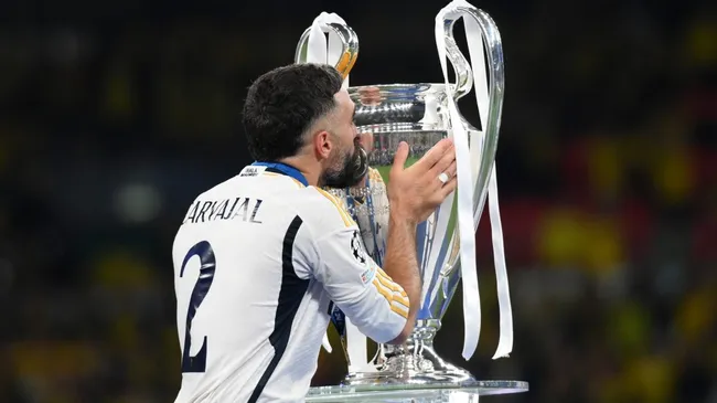 Daniel Carvajal of Real Madrid kisses the UEFA Champions League Trophy in 2024. (Source: Justin Setterfield/Getty Images)