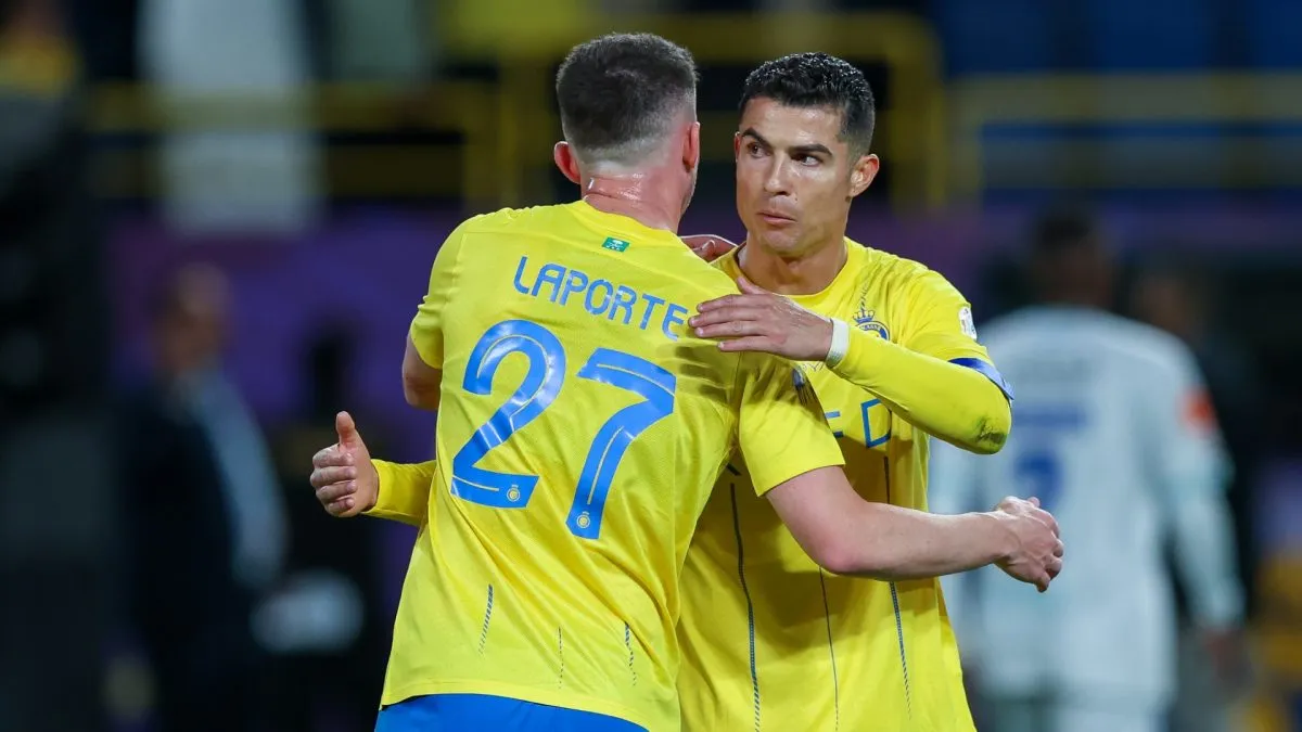 Cristiano Ronaldo and Laporte of Al Nassr celebrates after winning the Saudi Pro League match between Al-Nassr and Al Fateh at Al Awwal Park Stadium on February 17, 2024 in Riyadh, Saudi Arabia.