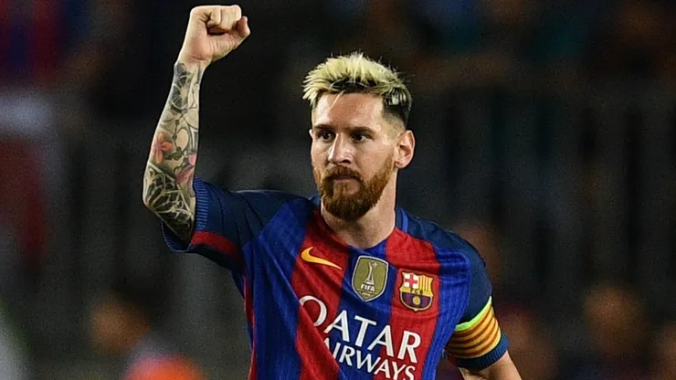 Lionel Messi celebrates scoring a goal during a UEFA Champions League game with Barcelona in 2016.
