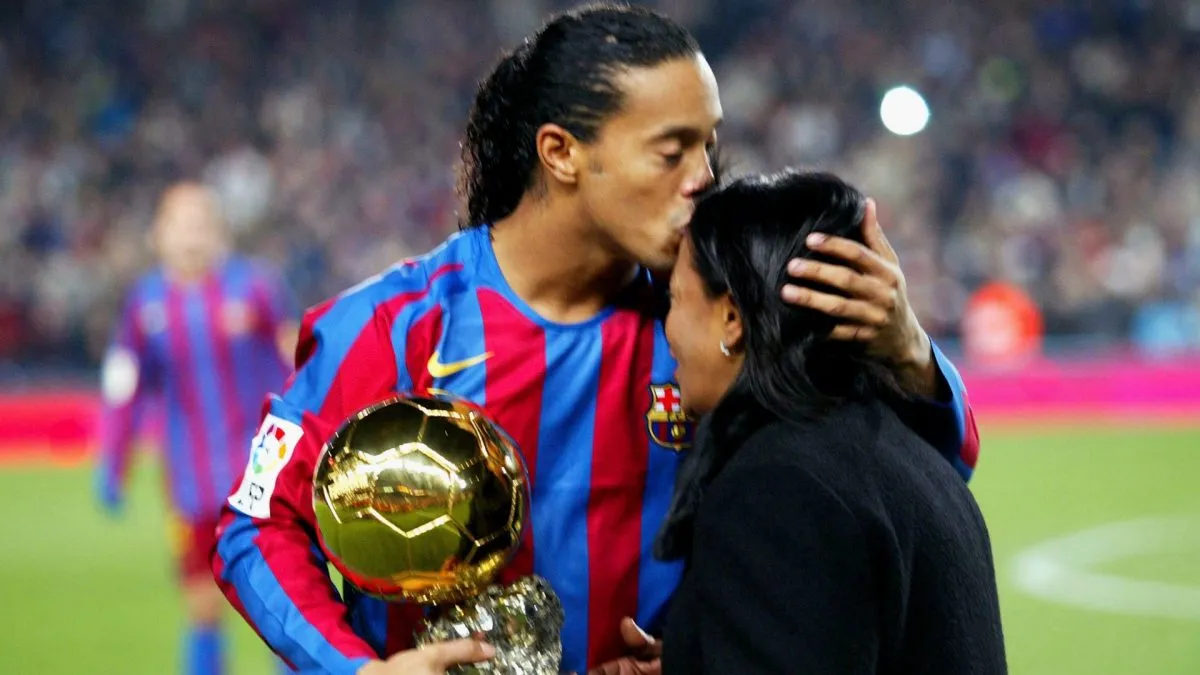 Ronaldinho of Barcelona kisses his mother as he holds the Ballon D’Or award for Footballer of the Year on December 11, 2005.