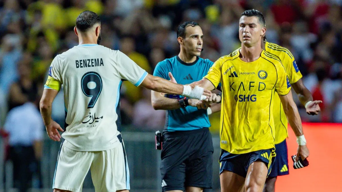 Cristiano Ronaldo of Al-Nassr (R) shakes hand with Karim Benzema of Al Ittihad (L) during to the Saudi Super Cup semi final.