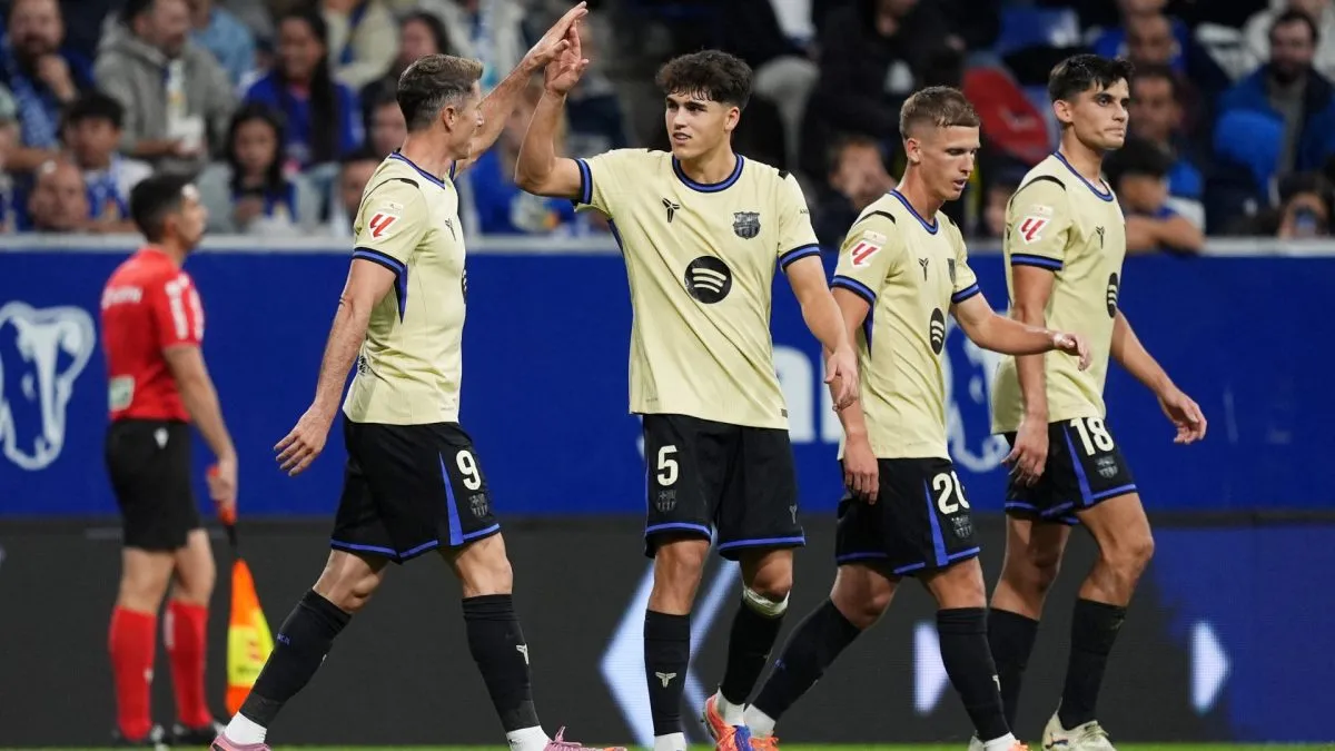 Robert Lewandowski of FC Barcelona celebrates scoring his sides second goal with teammates during the LaLiga EA Sports match between Real Oviedo and FC Barcelona.