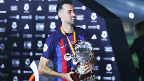 Sergio Busquets of FC Barcelona lifts the Super Copa de Espana trophy.