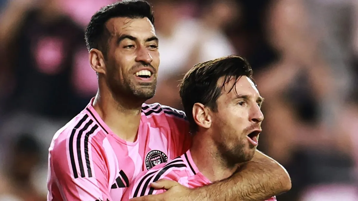 Lionel Messi #10 of Inter Miami CF celebrates with teammate Sergio Busquets #5 after scoring a goal.