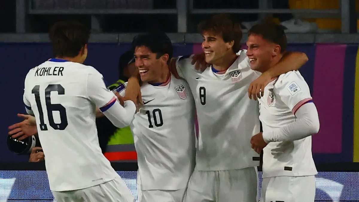 USMNT players celebrating after scoring a goal against New Caledonia.