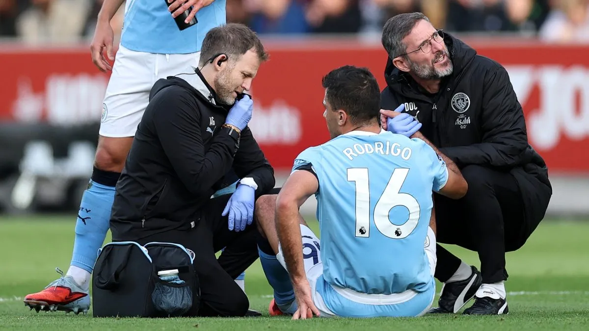 Rodri of Manchester City receives medical treatment to an injury before being substituted during the Premier League match between Brentford and Manchester City.