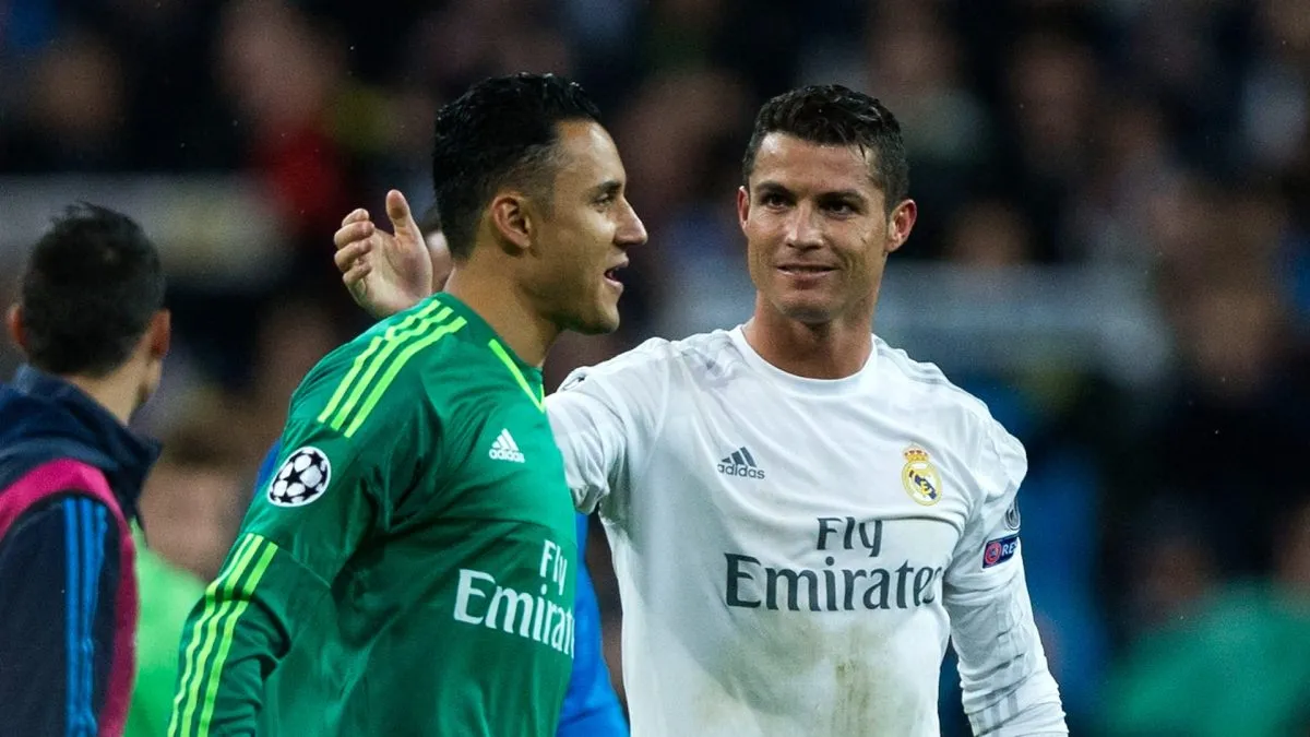 Hat trick scorer Cristiano Ronaldo of Real Madrid celebrates victory and reaching the semi finals with Keylor Navas after the UEFA Champions League quarter final second leg match between Real Madrid CF and VfL Wolfsburg.