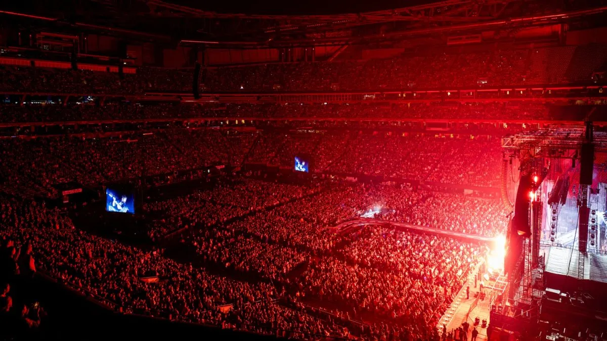 Post Malone performing at Mercedes-Benz Stadium.