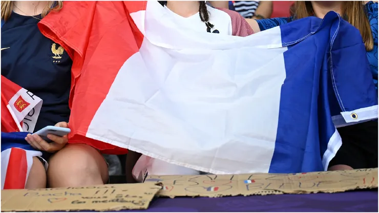 Fans of France wave their national flag