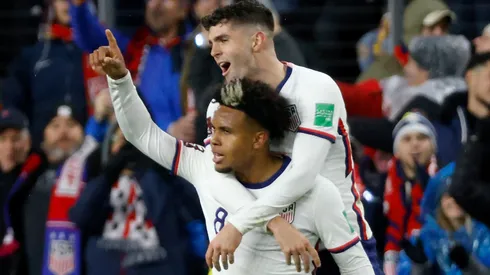 Weston McKennie #8 of the United States is congratulated by Christian Pulisic #10 after scoring a goal.