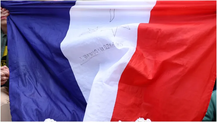 Fans hold up French flag
