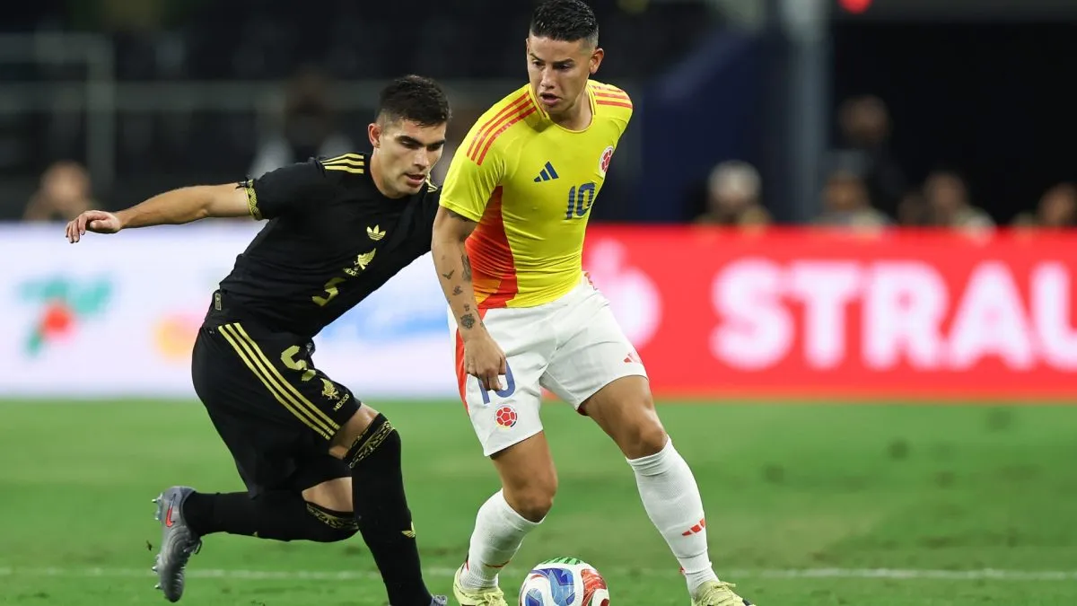James Rodriguez #10 of Colombia is marked by Johan Vasquez #5 of Mexico.