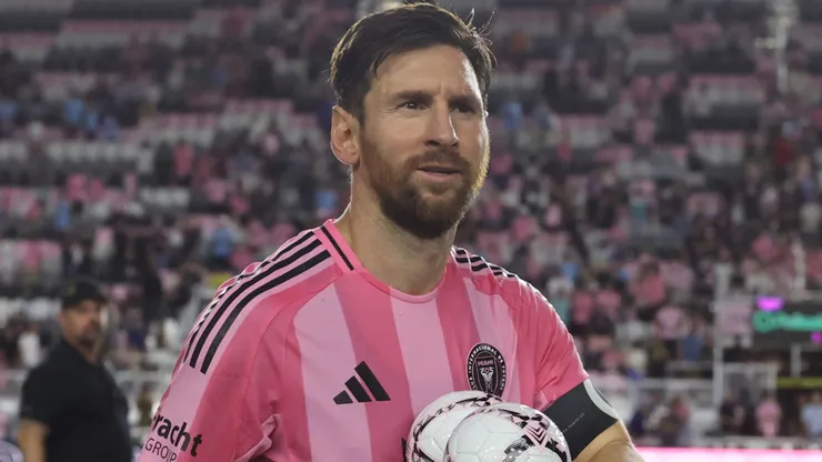 Lionel Messi #10 of Inter Miami CF takes balls to gift fans.