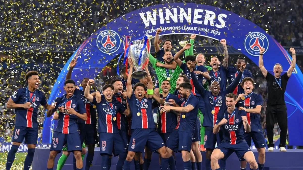 Marquinhos of Paris Saint-Germain lifts the UEFA Champions League trophy.